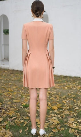 Elegant Peach Dress with Contrasting White Lapel