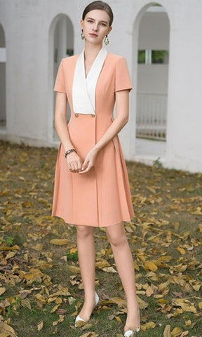 Elegant Peach Dress with Contrasting White Lapel